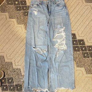 American Eagle Outfitters Light Blue Distressed Flare Jeans in short length.